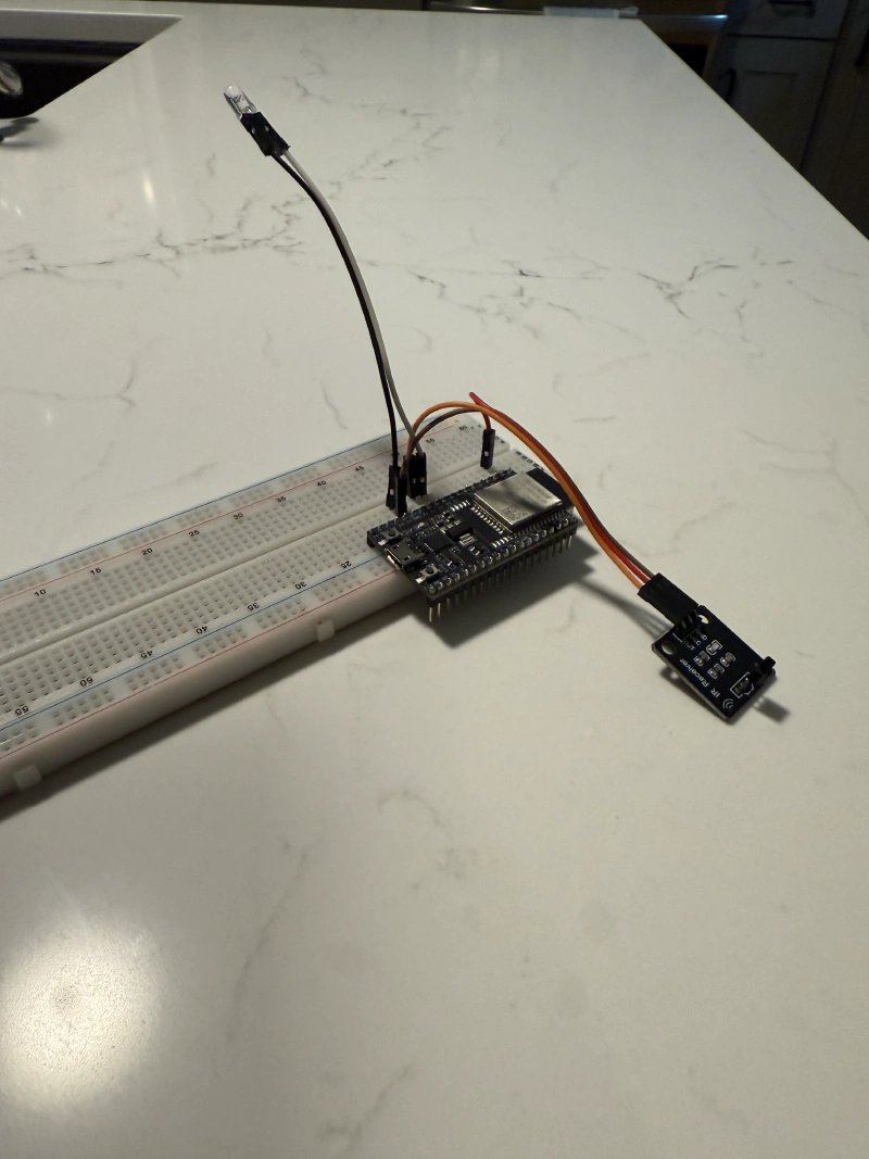 ESP32 hardware setup with IR transmitter on breadboard